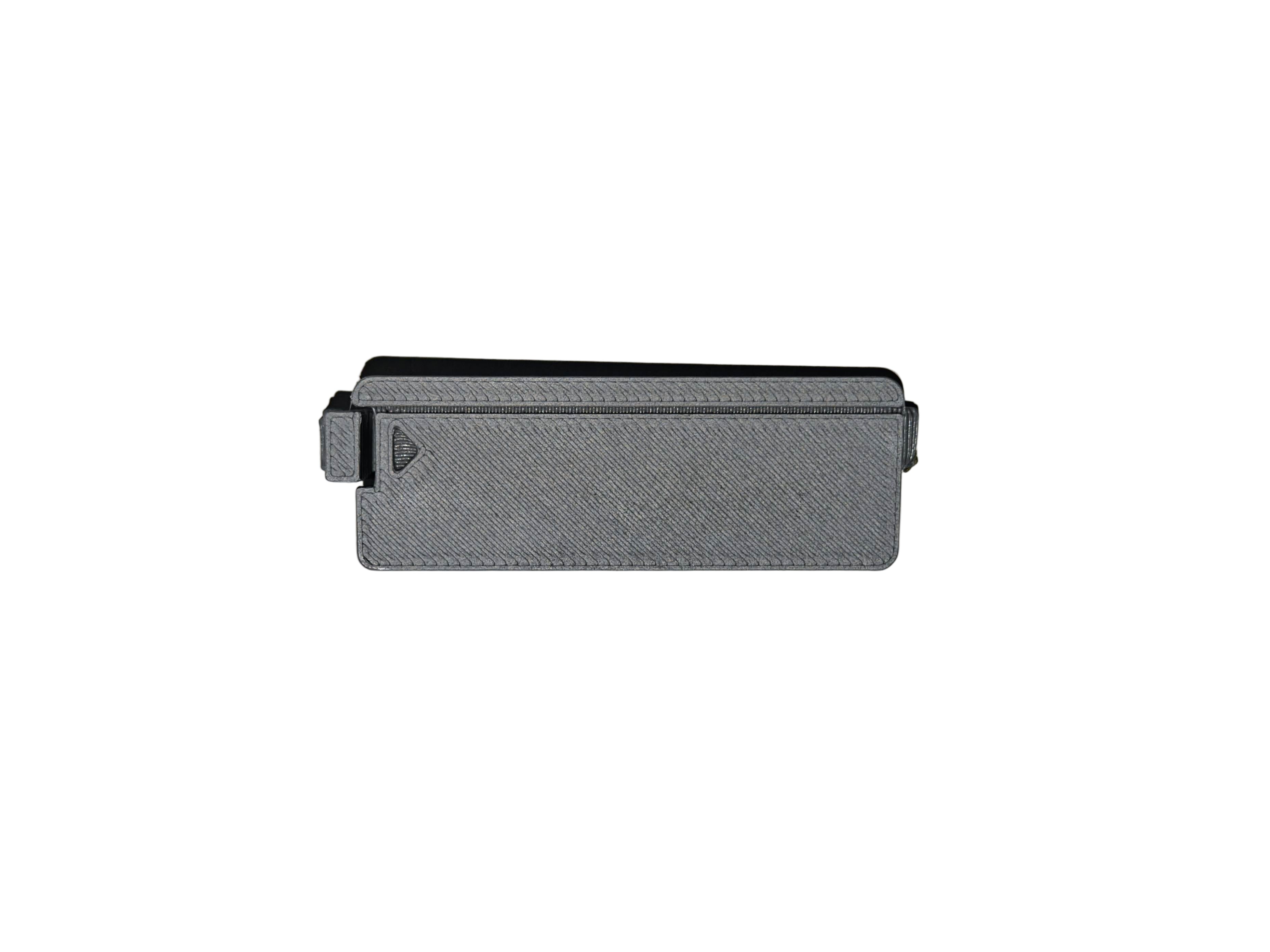 Small rectangular gray object on a light gray background